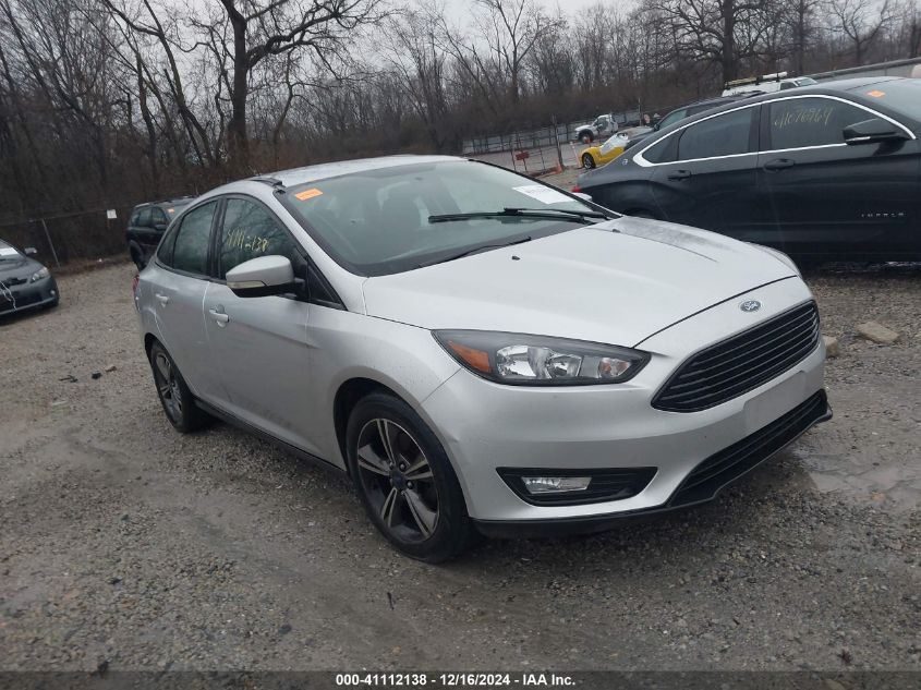 VIN 1FADP3FEXHL318323 2017 FORD FOCUS no.1