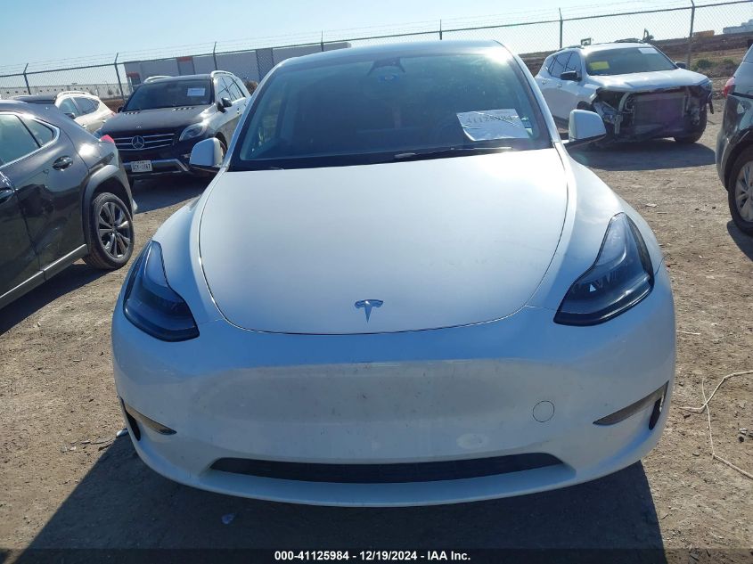 2023 Tesla Model Y Awd/Long Range Dual Motor All-Wheel Drive VIN: 7SAYGAEEXPF598086 Lot: 41125984