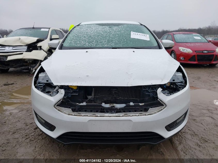 VIN 1FADP3FEXJL216137 2018 Ford Focus, SE no.13