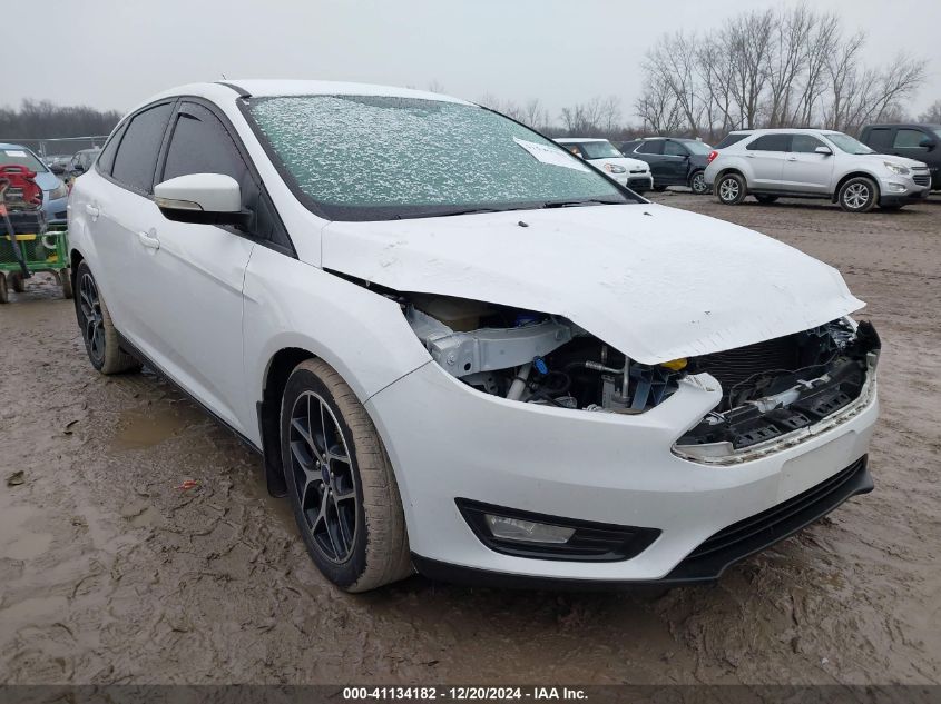 VIN 1FADP3FEXJL216137 2018 Ford Focus, SE no.1