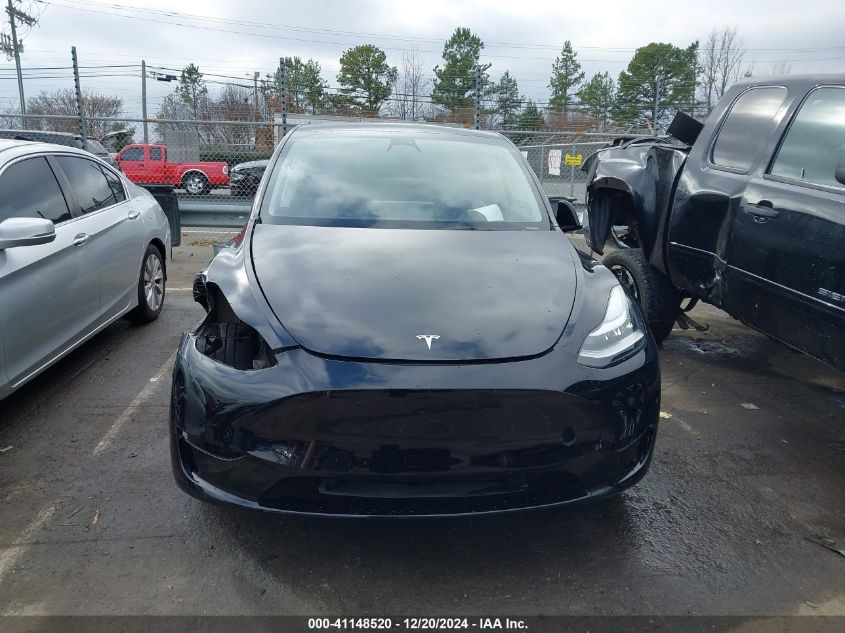 2023 Tesla Model Y Awd/Long Range Dual Motor All-Wheel Drive VIN: 7SAYGDEE0PA098842 Lot: 41148520