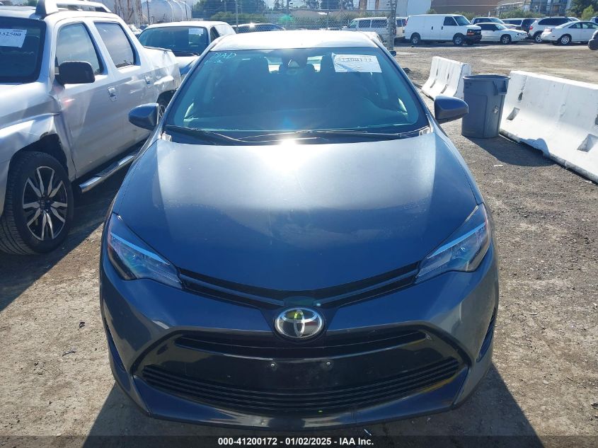 VIN 5YFBURHE6JP802674 2018 Toyota Corolla, LE no.12