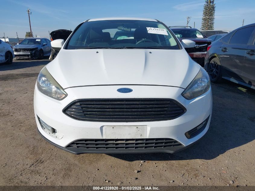 VIN 1FADP3FE7JL278854 2018 FORD FOCUS no.12