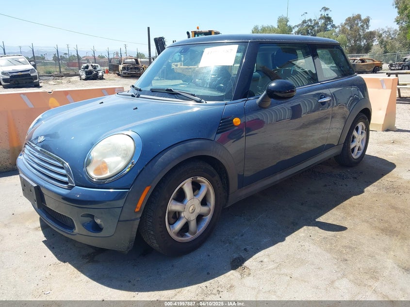 2010 MINI COOPER VIN: WMWMF3C56ATZ24156
