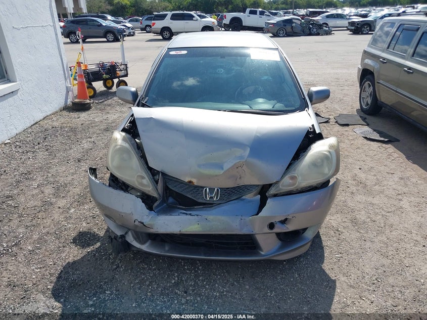 2009 HONDA FIT VIN: JHMGE874X9S005374