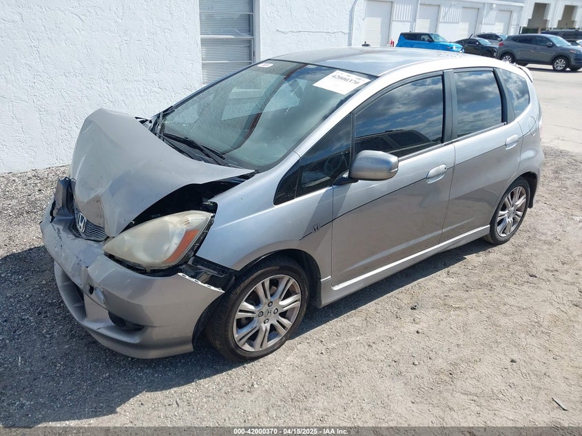 2009 HONDA FIT VIN: JHMGE874X9S005374