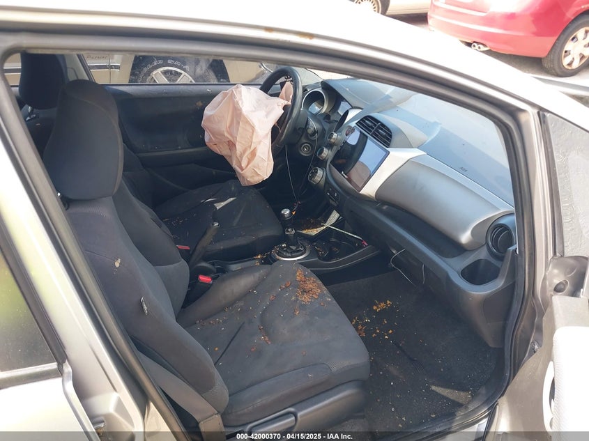 2009 HONDA FIT VIN: JHMGE874X9S005374
