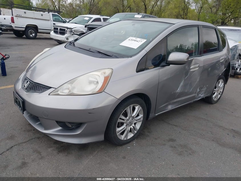 2009 HONDA FIT VIN: JHMGE88489S012483