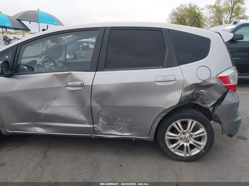 2009 HONDA FIT VIN: JHMGE88489S012483