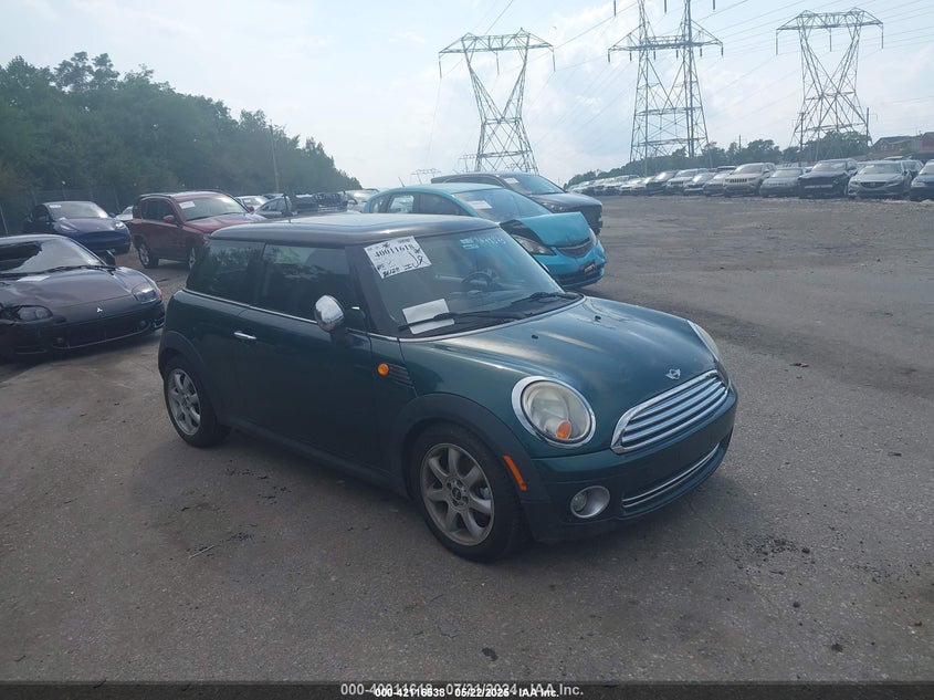2009 MINI COOPER VIN: WMWMF33559TW74873