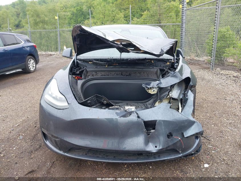 2023 Tesla Model Y Awd/Long Range Dual Motor All-Wheel Drive VIN: 7SAYGAEE1PF584206 Lot: 42284501