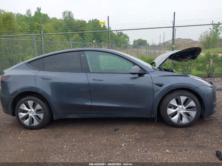 2023 Tesla Model Y Awd/Long Range Dual Motor All-Wheel Drive VIN: 7SAYGAEE1PF584206 Lot: 42284501
