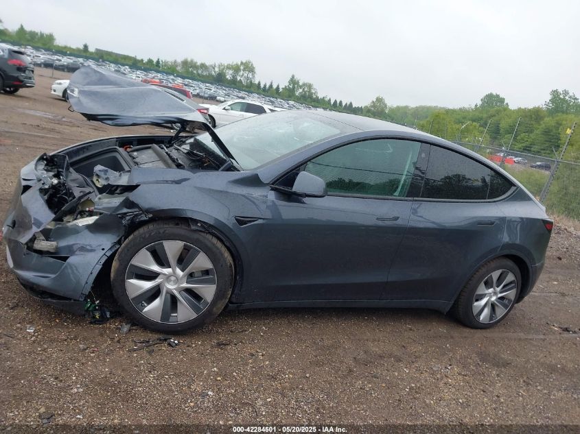 2023 Tesla Model Y Awd/Long Range Dual Motor All-Wheel Drive VIN: 7SAYGAEE1PF584206 Lot: 42284501