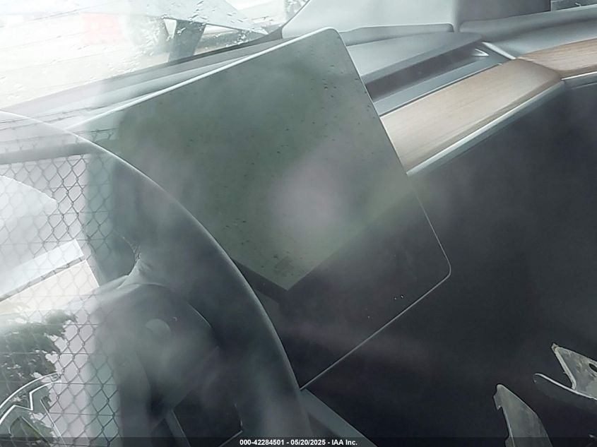 2023 Tesla Model Y Awd/Long Range Dual Motor All-Wheel Drive VIN: 7SAYGAEE1PF584206 Lot: 42284501