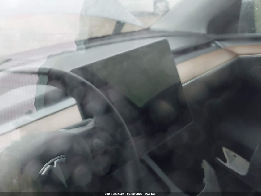 2023 Tesla Model Y Awd/Long Range Dual Motor All-Wheel Drive VIN: 7SAYGAEE1PF584206 Lot: 42284501