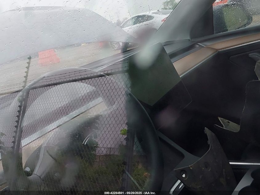 2023 Tesla Model Y Awd/Long Range Dual Motor All-Wheel Drive VIN: 7SAYGAEE1PF584206 Lot: 42284501