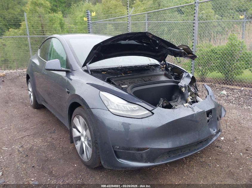 2023 Tesla Model Y Awd/Long Range Dual Motor All-Wheel Drive VIN: 7SAYGAEE1PF584206 Lot: 42284501