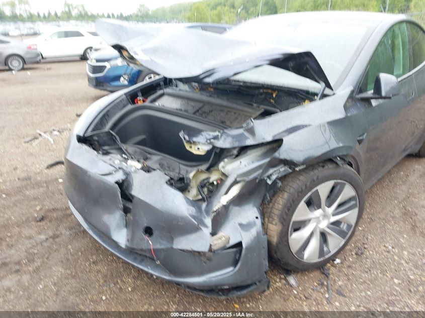 2023 Tesla Model Y Awd/Long Range Dual Motor All-Wheel Drive VIN: 7SAYGAEE1PF584206 Lot: 42284501