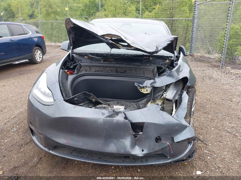 2023 Tesla Model Y Awd/Long Range Dual Motor All-Wheel Drive VIN: 7SAYGAEE1PF584206 Lot: 42284501