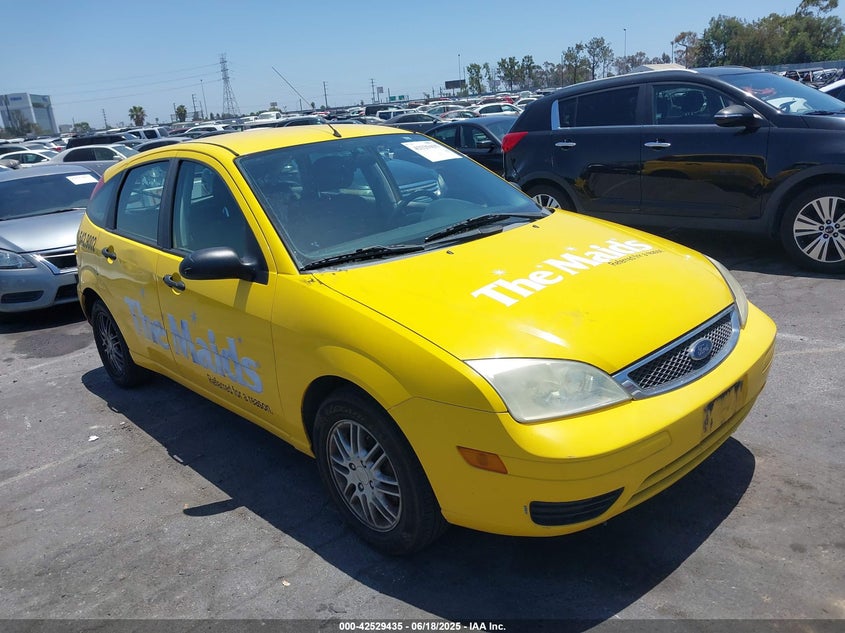2006 Ford Focus Zx5 yellow hatchback gasoline 1FAFP37N36W185388 photo #1