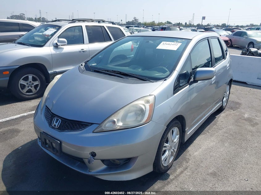 2009 HONDA FIT VIN: JHMGE88499S008698