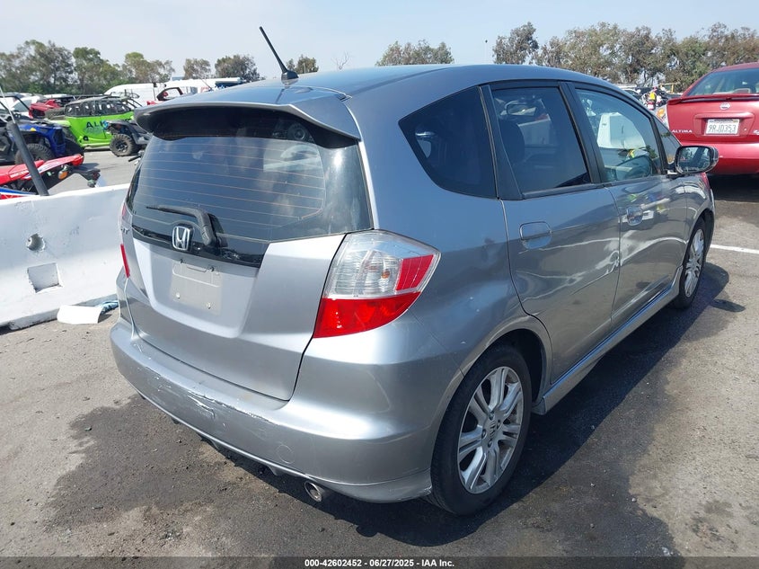 2009 HONDA FIT VIN: JHMGE88499S008698