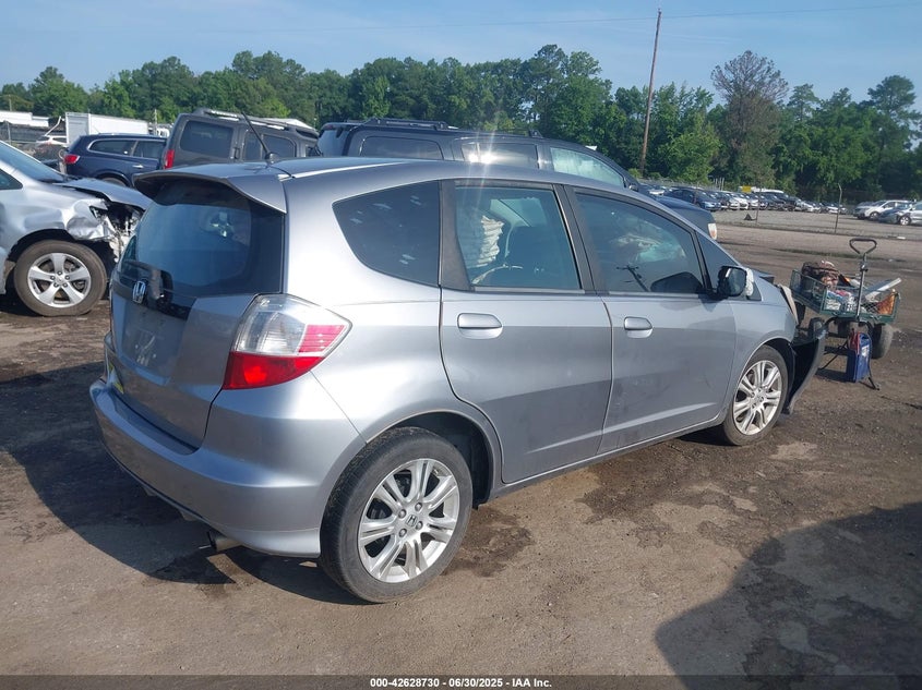 2009 HONDA FIT VIN: JHMGE88659S013897