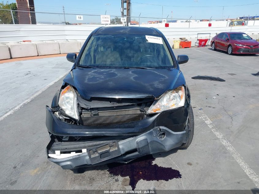 2009 Honda Cr-V Lx VIN: JHLRE38349C013132 Lot: 42690884