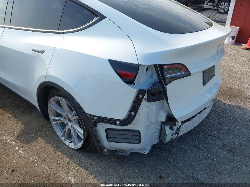 2023 Tesla Model Y Awd/Long Range Dual Motor All-Wheel Drive VIN: 7SAYGDEE0PF674299 Lot: 42803531