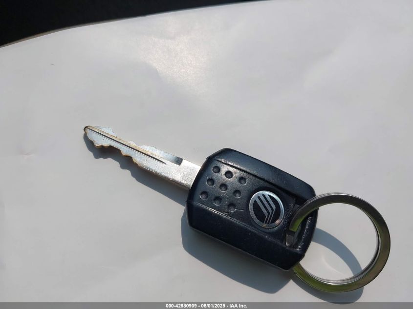 2005 Mercury Grand Marquis Gs VIN: 2MEFM74W65X668639 Lot: 42880909