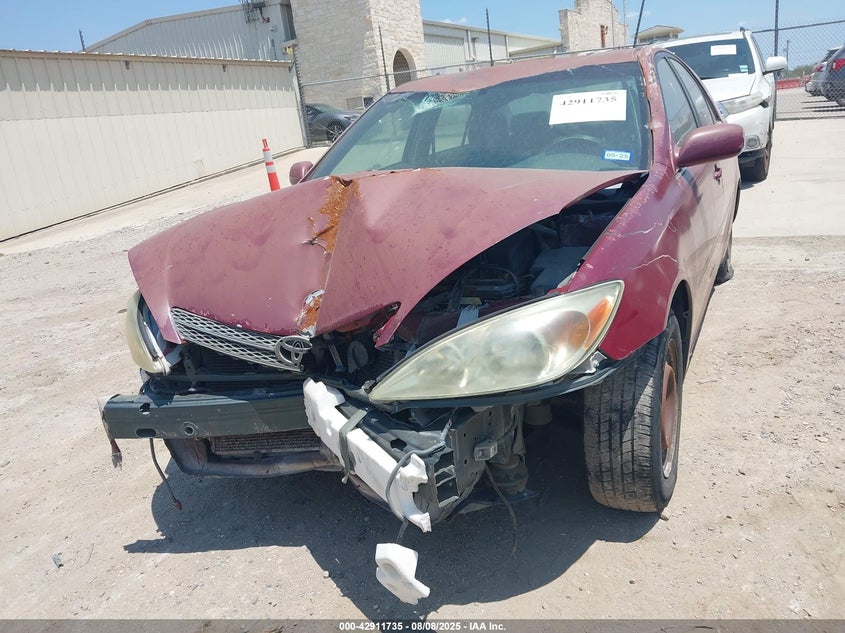 2002 Toyota Camry Le VIN: JTDBE32K320007053 Lot: 42911735