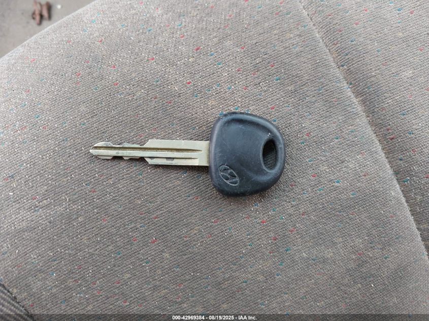 2002 Hyundai Accent L VIN: KMHCF35G12U230303 Lot: 42969384