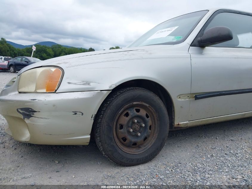 2002 Hyundai Accent L VIN: KMHCF35G12U230303 Lot: 42969384