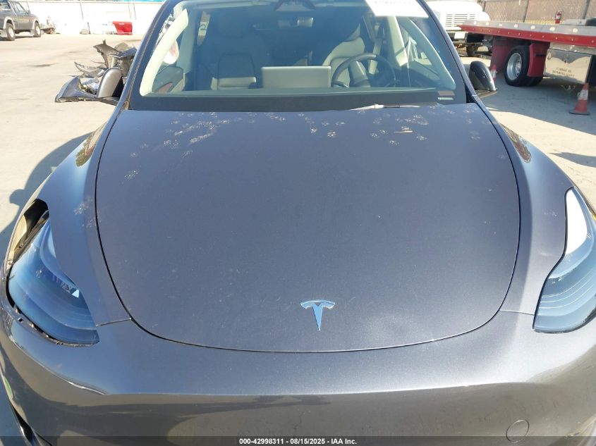 2023 Tesla Model Y VIN: 7SAYGDEE3PF831212 Lot: 42998311