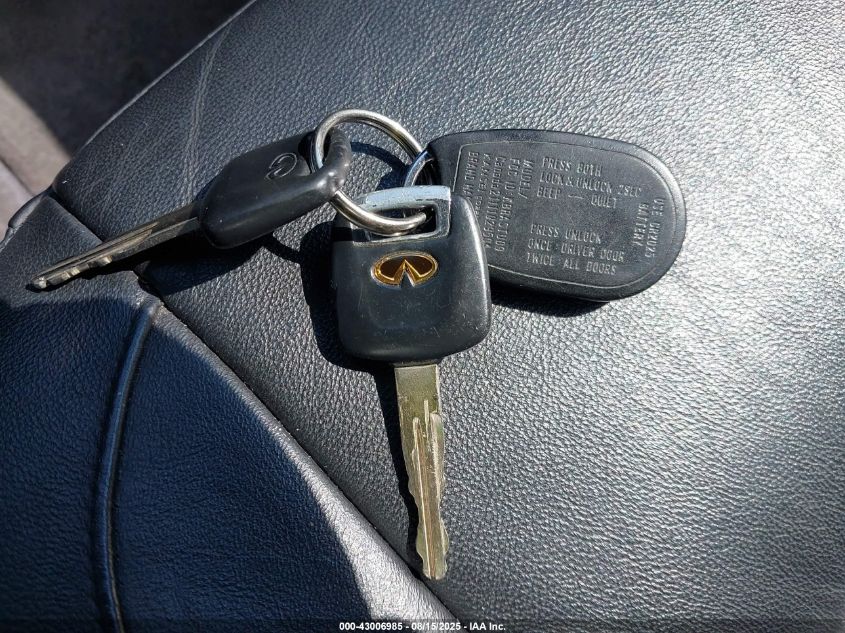 2000 Infiniti G20 Luxury/Touring VIN: JNKCP11A2YT301058 Lot: 43006985