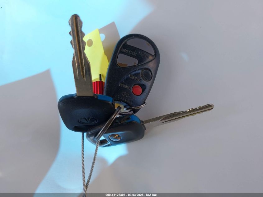 2000 Infiniti G20 Luxury/Touring VIN: JNKCP11A7YT301329 Lot: 43127306