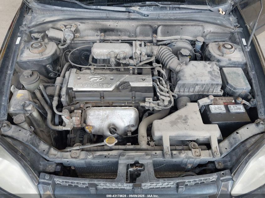 2004 Hyundai Accent VIN: KMHCF35C74U310141 Lot: 43178628