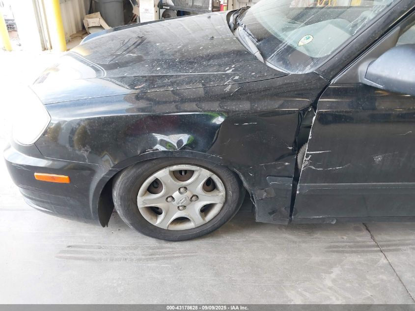 2004 Hyundai Accent VIN: KMHCF35C74U310141 Lot: 43178628