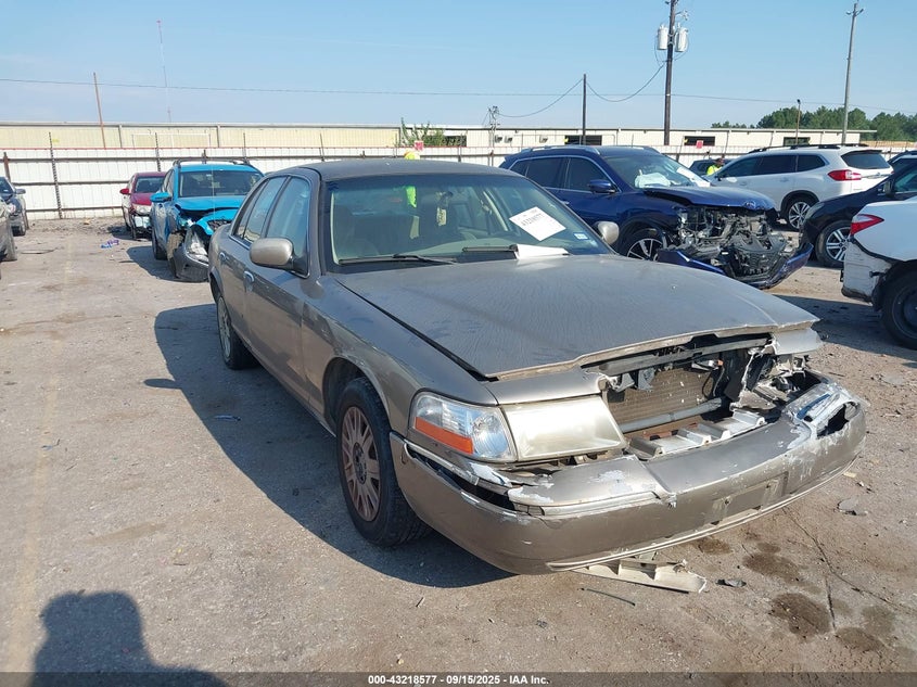 2005 Mercury Grand Marquis Gs gold sedan gasoline 2MEFM74W25X625920 photo #1