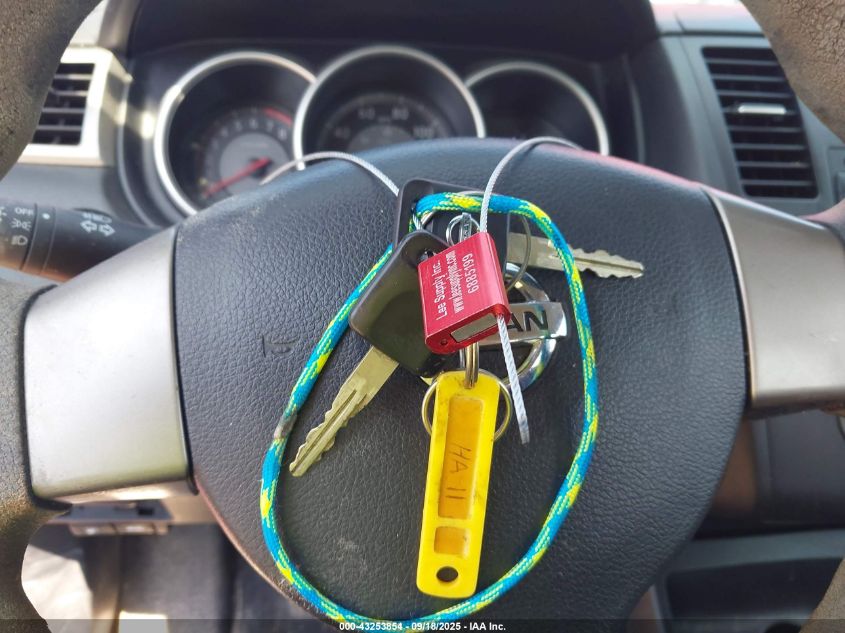 2009 Nissan Versa 1.8S VIN: 3N1BC13E59L471304 Lot: 43253854