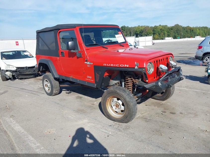 2006 Jeep Wrangler Unlimited Rubicon orange suv gasoline 1J4FA64S86P778174 photo #1