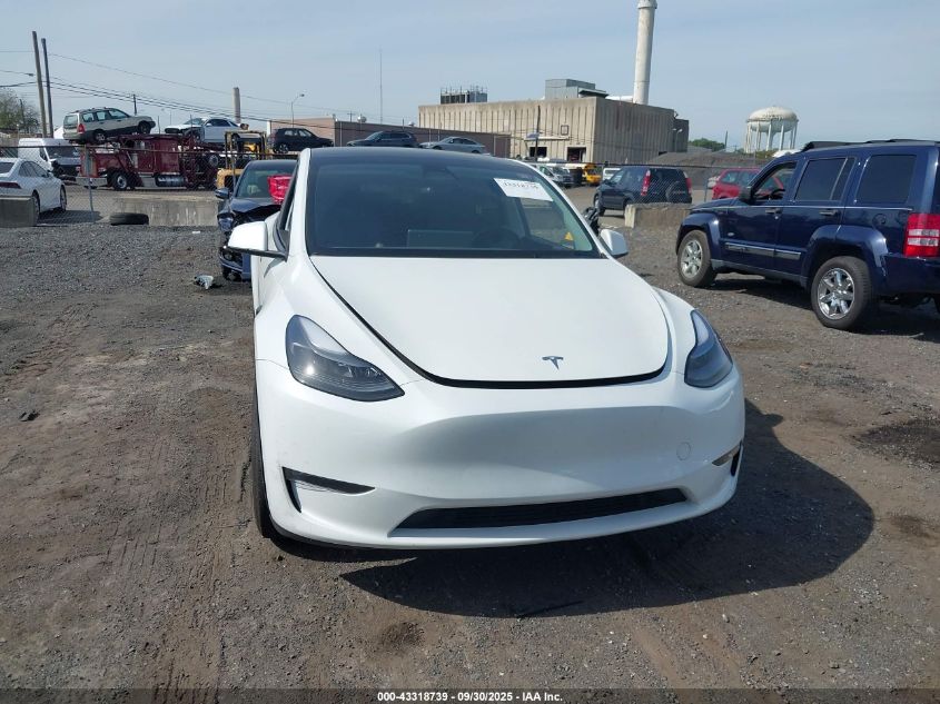 2023 Tesla Model Y Awd/Long Range Dual Motor All-Wheel Drive VIN: 7SAYGAEEXPF759410 Lot: 43318739