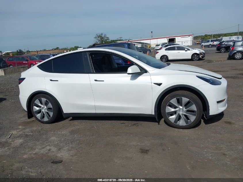 2023 Tesla Model Y Awd/Long Range Dual Motor All-Wheel Drive VIN: 7SAYGAEEXPF759410 Lot: 43318739