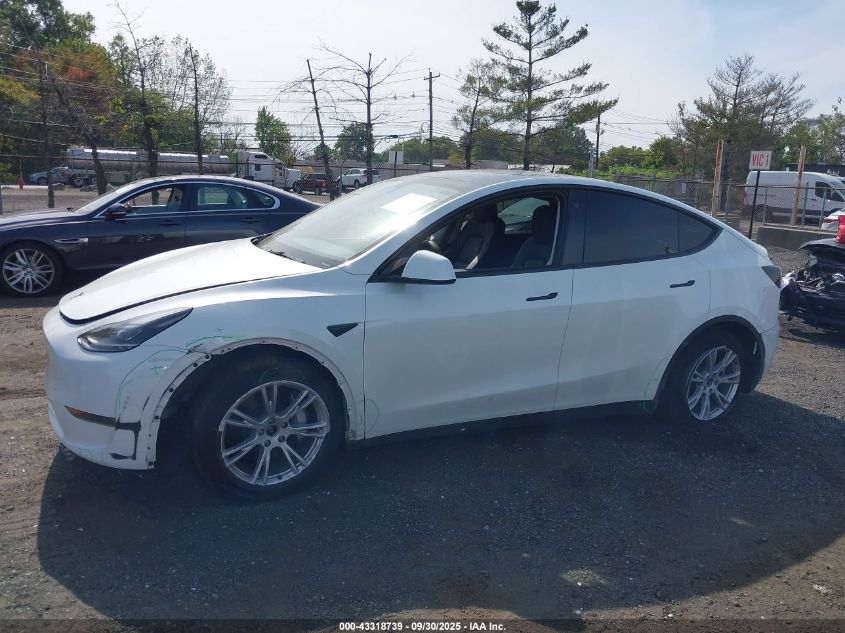 2023 Tesla Model Y Awd/Long Range Dual Motor All-Wheel Drive VIN: 7SAYGAEEXPF759410 Lot: 43318739