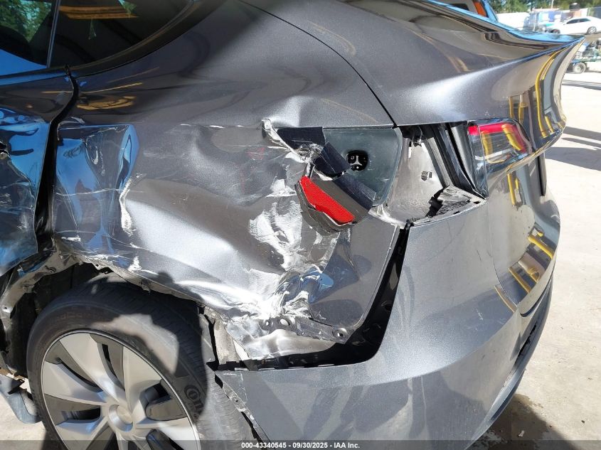 2023 Tesla Model Y Awd/Long Range Dual Motor All-Wheel Drive VIN: 7SAYGDEE6PF886642 Lot: 43340545