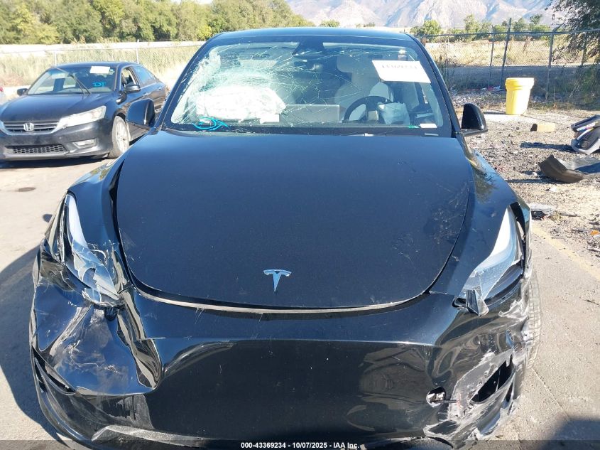 2023 Tesla Model Y Awd/Long Range Dual Motor All-Wheel Drive VIN: 7SAYGAEE1PF911557 Lot: 43369234