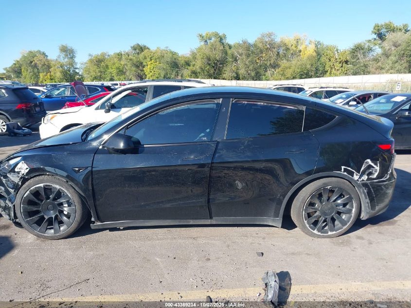 2023 Tesla Model Y Awd/Long Range Dual Motor All-Wheel Drive VIN: 7SAYGAEE1PF911557 Lot: 43369234