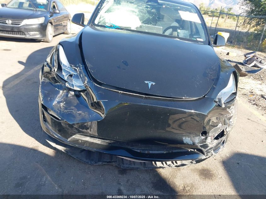 2023 Tesla Model Y Awd/Long Range Dual Motor All-Wheel Drive VIN: 7SAYGAEE1PF911557 Lot: 43369234