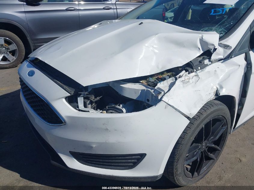 2015 Ford Focus S VIN: 1FADP3E21FL324158 Lot: 43396939