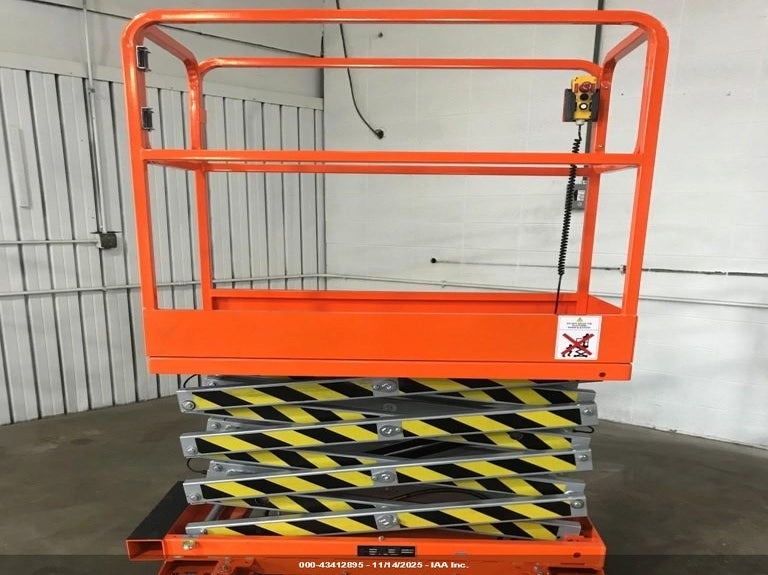 2025 ORANGE SCISSOR LIFT P/U AT BRANCH